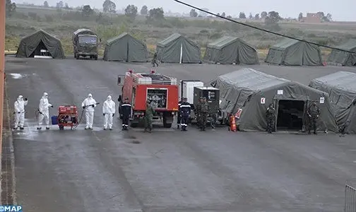 بعد قرار تجميعهم .. نقل مصابين بكورونا الى المستشفى الميداني ابن جرير