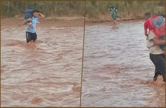أب يحمل ابنه لعبور الوادي.. مطالب ببناء منشآت فنية على وادي دادس نواحي ورزازات