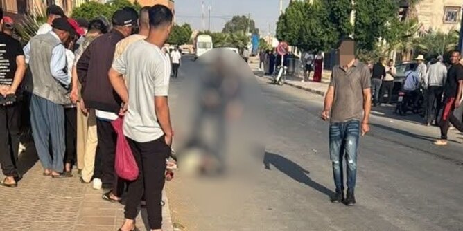 شارع عام في سيدي بوعثمان يظهر أشخاصاً ومركبات وجسم غير واضح