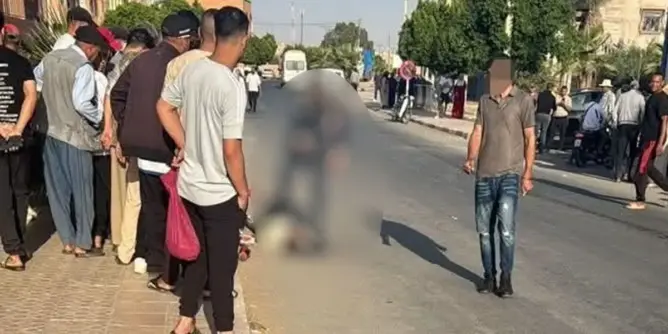 شارع عام في سيدي بوعثمان يظهر أشخاصاً ومركبات وجسم غير واضح